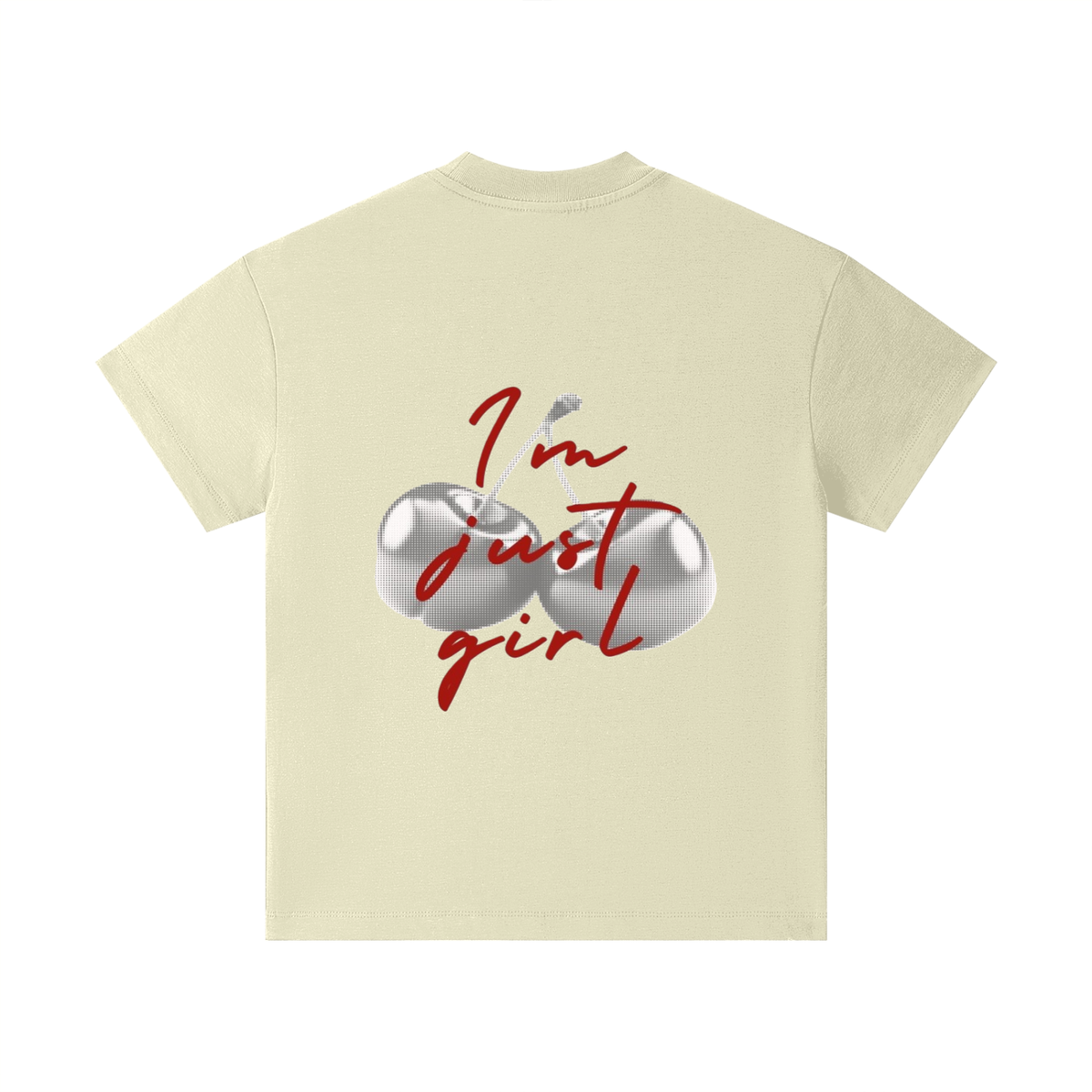 A cream-colored short-sleeve t-shirt with a graphic on the front featuring two metallic silver eggs and the red cursive text 'I'm just girl' with a small bird.