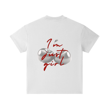 A white short-sleeve t-shirt shown from the back, featuring a graphic print of two metallic silver cherries with a red arrow and the text 'I'm just girl' in red script.