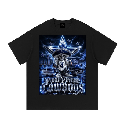 A black short-sleeve t-shirt with a large graphic print on the front. The graphic features a cartoon skeleton wearing a sombrero and a jersey with the number 4, standing in front of a blue star, cars, and the text 'Puro Pinche Cowboys'.